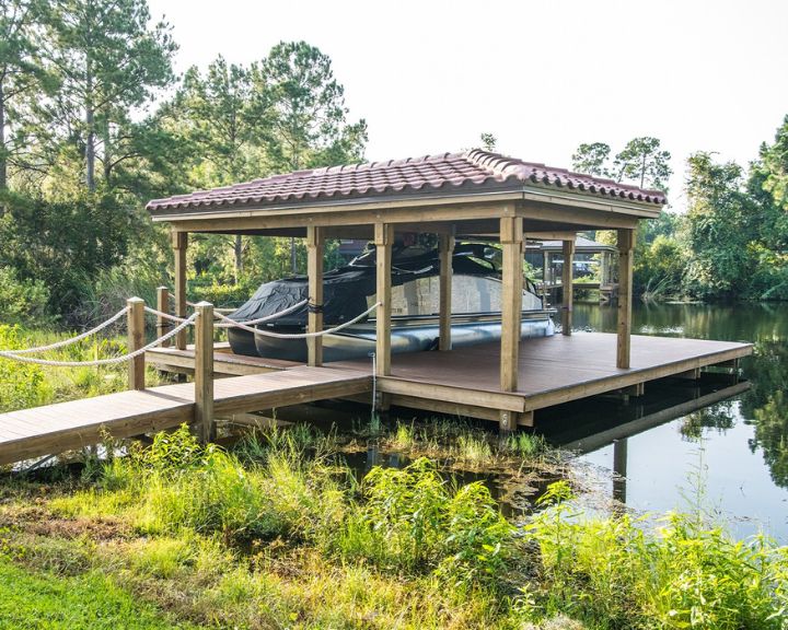 Orlando's premier Dock Builders present a stunning wooden dock showcasing a sleek boat.
