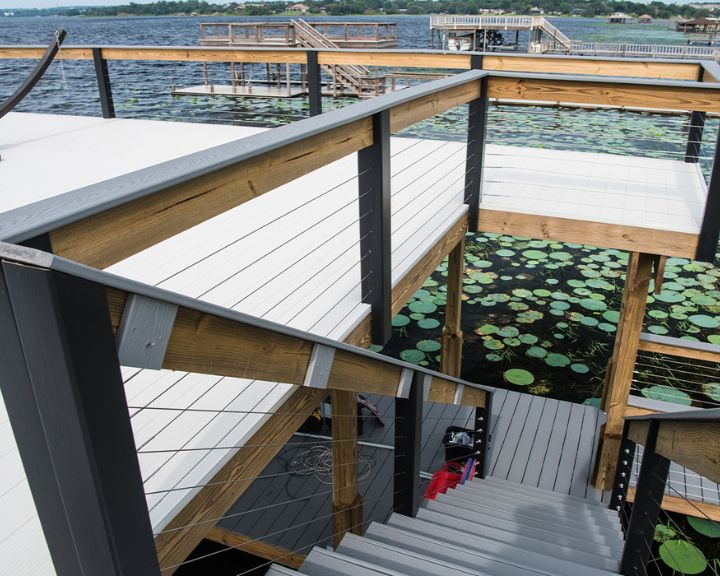 A beautiful stairway leading to a dock adorned with water lilies, expertly constructed by Orlando Dock Builders.