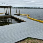 A dock with a yellow hose attached to it.